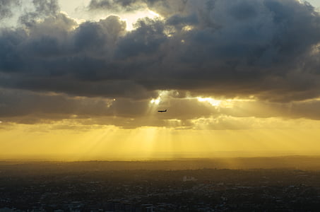 plane under cloudy sky thumbnail