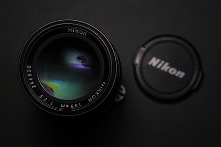 black Nikon Nikkor 135 mm lens thumbnail
