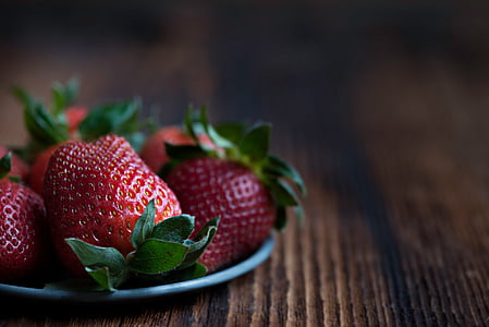 strawberries on silver saucer tilt shift lens photography thumbnail