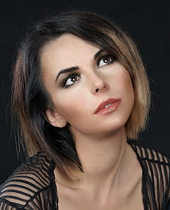 woman wearing black sheer top looking up thumbnail