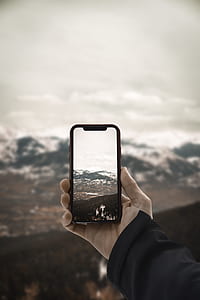 person holding Android smartphone thumbnail