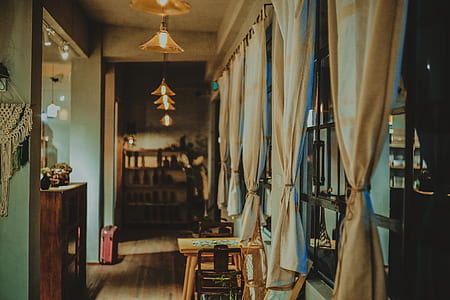 room with pendant lights and white curtains thumbnail