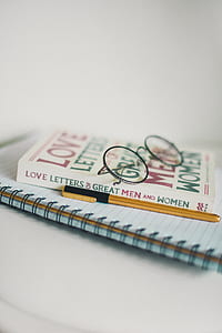 round eyeglasses with black frames on Love Letters of Great Men and Women book\ thumbnail