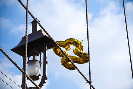 black metal outdoor lantern at daytime thumbnail