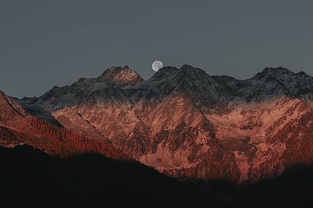 gray mountains under full moon thumbnail