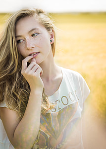 woman wearing white scoop-neck cap-sleeved shirt during day time thumbnail