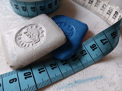 two blue and gray soap beside measuring tape thumbnail