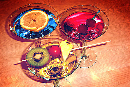 three assorted cocktail drinks in cocktail glasses thumbnail