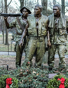 three army men statue during daytime thumbnail