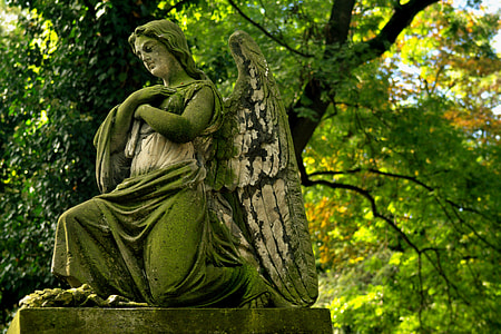 archangel statue near tree thumbnail