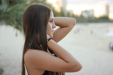 woman in black halter top selective focus photography thumbnail
