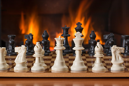 white, black, and brown Chess pieces on chess board thumbnail