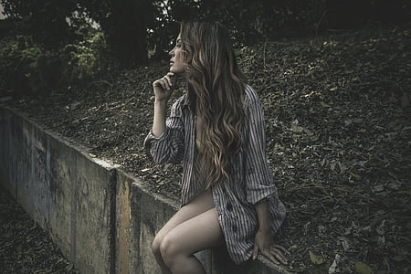 woman sitting on concrete edge thumbnail