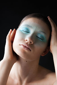photography of woman holding touching her face thumbnail