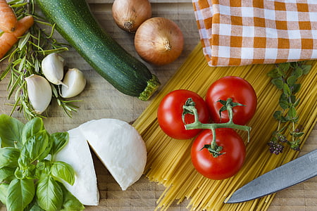 several red tomatoes above spaghetti pasta thumbnail