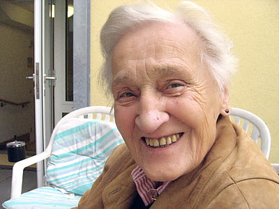 photo of person with brown top smiling thumbnail