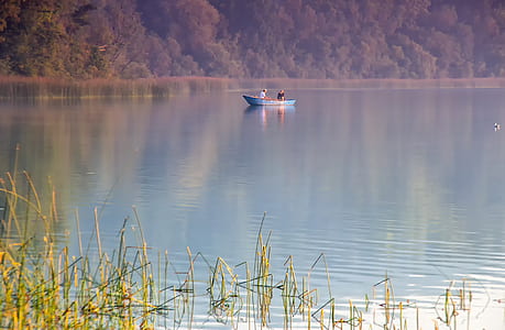 people in the boat near body of water thumbnail