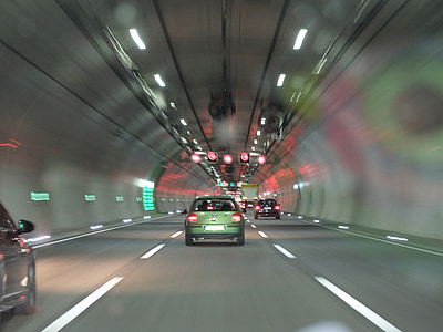 timelapse photography of vehicle inside tunnel thumbnail