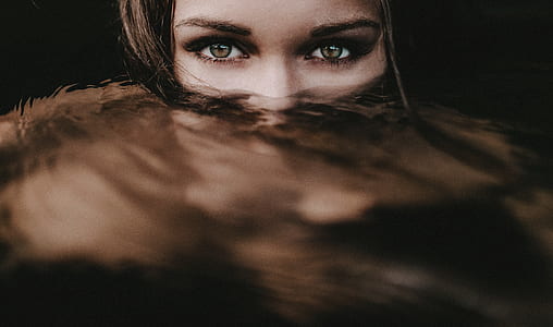 portrait photo of a woman showing half of her face thumbnail