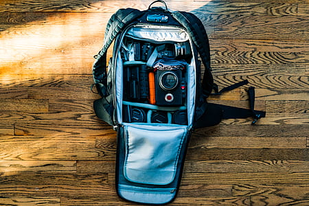 gray trail camera bag on brown wooden panel thumbnail
