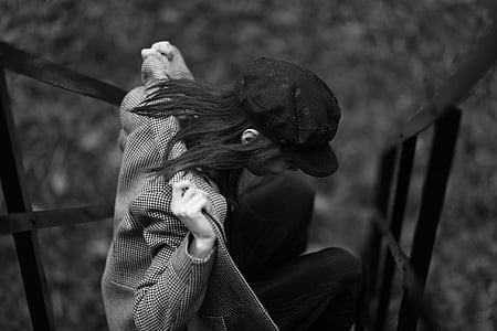 grayscale photography of woman wearing jacket thumbnail