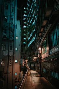 grey and brown concrete high-rise building during night time thumbnail