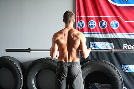 man holding barbell bar thumbnail