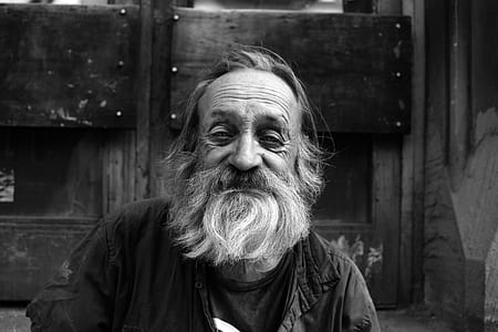 grayscale photography of man with beard smiling thumbnail