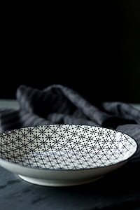 closeup photography of white and black saucer thumbnail