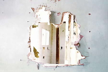 white wall with hole thumbnail