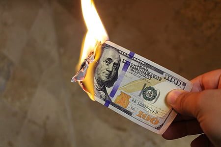 person holding 100 U.S. Dollar banknote thumbnail