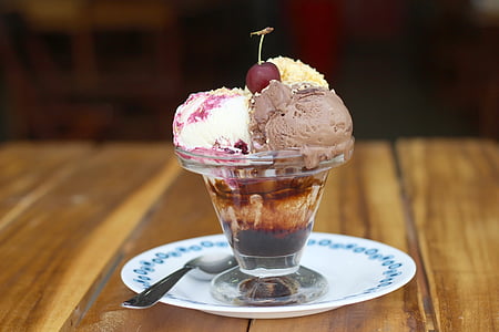 assorted-flavor ice creams in clear glass container thumbnail