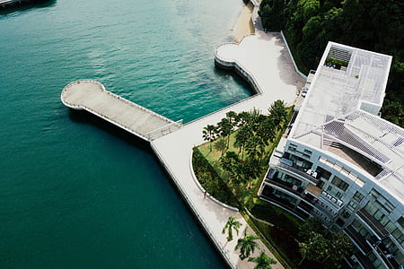 white concrete building on body of water thumbnail