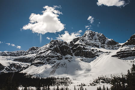 landscape photography of snowy mountain under cloudy sky thumbnail