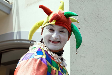 person in clown costume near wall thumbnail