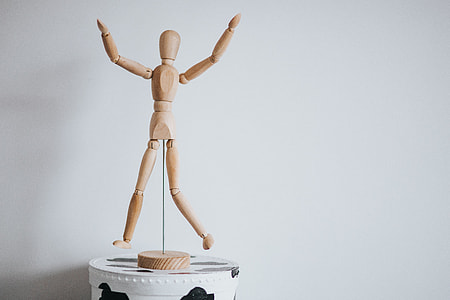 Wooden mannequin in various poses thumbnail
