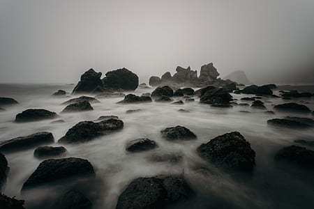 black stone on body of water thumbnail