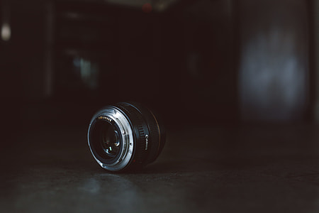 focused close-up photo of black and gray camera lens thumbnail