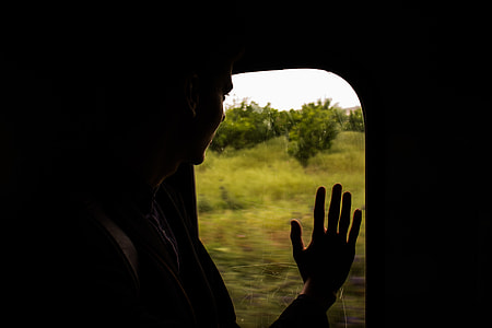 person palm on transportation unit window thumbnail