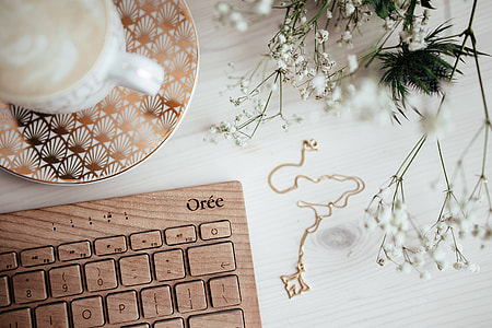 Wooden keyboard and cup of coffee thumbnail