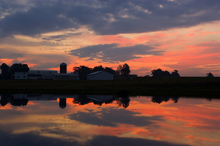 golden hour photography of houses and body of water thumbnail