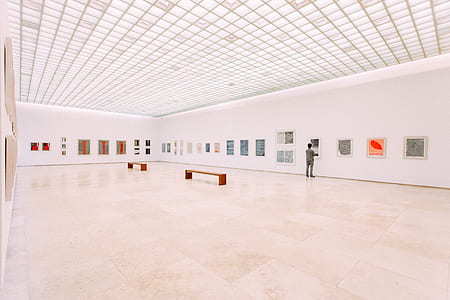 man standing inside a white room thumbnail