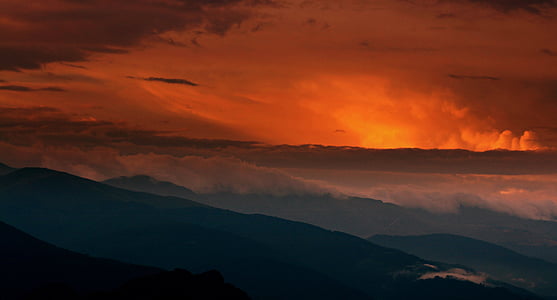 sea of clouds and mountain ranges under golden hour thumbnail