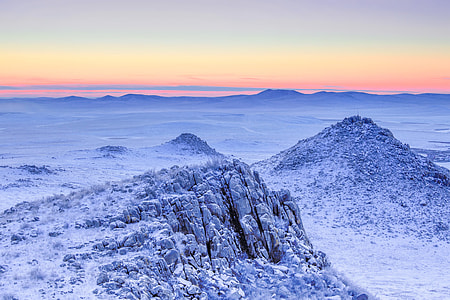 mountain coated with snow during golden houe thumbnail