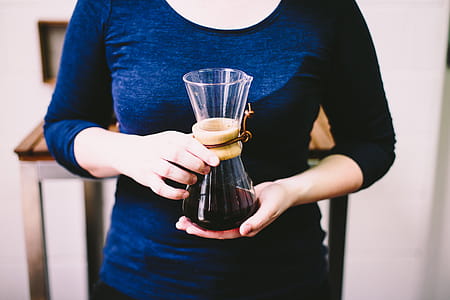 Person Holding Clear Glass Vase thumbnail
