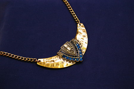 photo of blue gemstone encrusted gold-colored pendant thumbnail