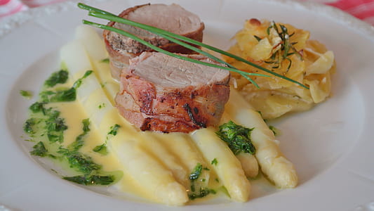 potato topped with fried meat and parsley thumbnail