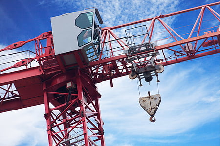 low angle photography of red conveyor crane thumbnail