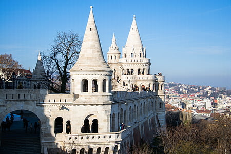 white concrete castle in the middle of threes thumbnail
