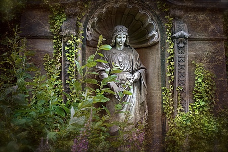 religious statue between green leaf plant thumbnail